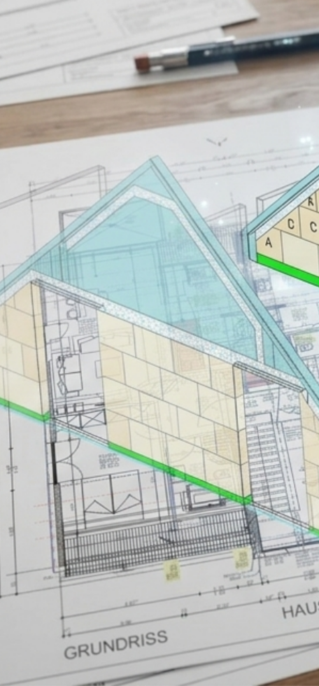Architektenpläne mit darüber projizierten farbigen Wänden mit Steinschichten.